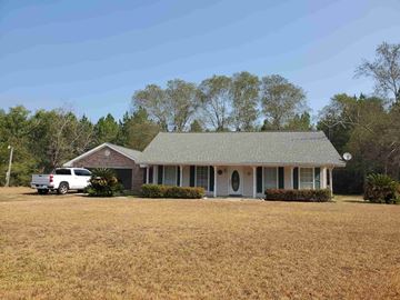 Deridder house for rent - a house with a white truck parked in front of it