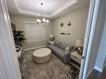 Palmetto house for rent - a living room with a couch and a table