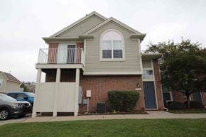 Shelby Township house for rent - the front of a house with a porch and a sidewalk