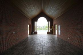 Shelby Township house for rent - the inside of a building with a large window and brick walls