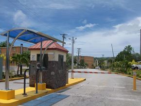 Tamuning apartment for rent - a toll booth at a gas station in a parking lot