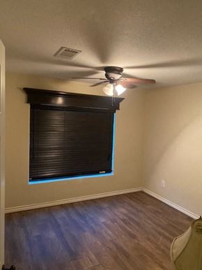 Pasadena house for rent - a living room with a window and a ceiling fan
