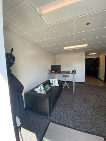 Vancouver apartment for rent - a living room with a couch and a desk