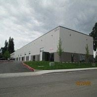 Vancouver apartment for rent - a large white building on the side of a street