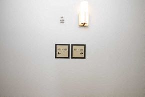 Miami apartment for rent - a white wall with two switches and a candle