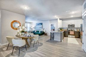 Daytona Beach apartment for rent - A modern kitchen with a dining table set for four.
