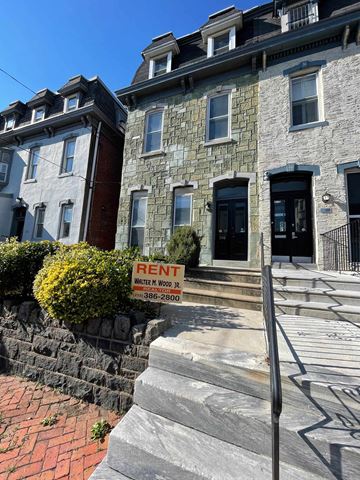 Philadelphia apartment for rent - a building with a rent sign in front of it