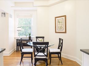 Washington apartment for rent - a dining room with a table and chairs and a window