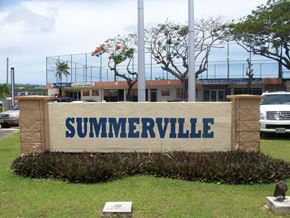 Tamuning apartment for rent - the sign in front of a parking lot