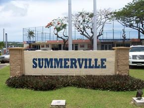 Tamuning apartment for rent - the sign in front of a parking lot