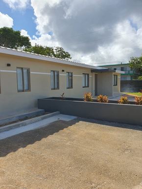 Yigo apartment for rent - a view of the front of a house from the driveway
