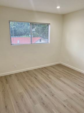 Los Angeles apartment for rent - A room with a window and wooden flooring.