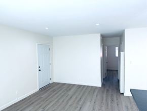 Los Angeles apartment for rent - A room with a white door and a grey rug.