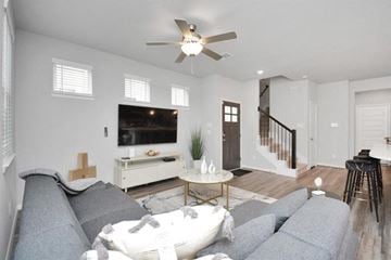 Houston house for rent - a living room with a couch and a ceiling fan