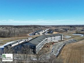 St Joseph apartment for rent - an aerial view of a building with a hangar and a building under construction