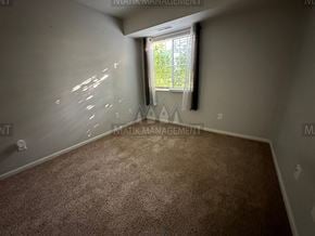 Rochester apartment for rent - a room with a carpet and a window
