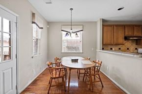 Rosharon house for rent - A dining room with a round table and chairs.