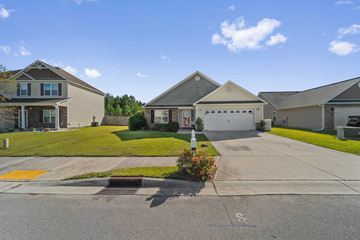 Jacksonville house for rent - a house with a driveway and a white garage door