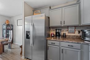 Jacksonville house for rent - a kitchen with stainless steel appliances and white cabinets