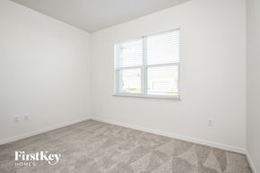 Bartow house for rent - a bedroom with a window and white walls and carpet