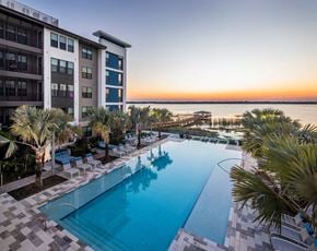 Orlando apartment for rent - a swimming pool at the resort on the water at sunset