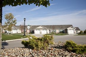 Cuyahoga Falls apartment for rent - a group of houses in front of a parking lot