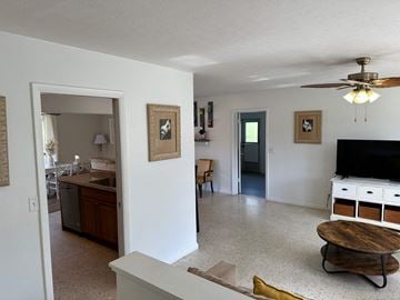 Bradenton house for rent - a view of a living room and a kitchen with a tv