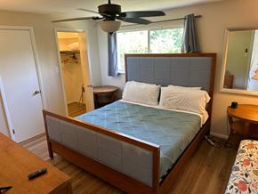 Bradenton house for rent - a bedroom with a bed and a ceiling fan