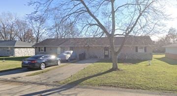 Muncie apartment for rent - a house with cars parked in front of it
