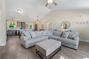 Jacksonville house for rent - A living room with a grey couch and a coffee table.