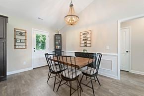 Jacksonville house for rent - A dining room with a wooden table and chairs.