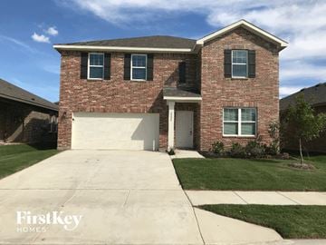 Ft. Worth house for rent - a large brick house with a white garage door