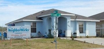 Laredo house for rent - a blue house with a street sign in front of it