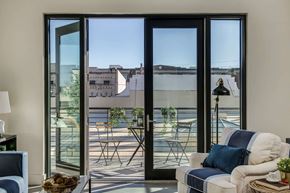 Tampa apartment for rent - a living room with glass doors and a balcony