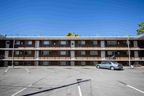 Provo apartment for rent - an empty parking lot in front of an apartment building