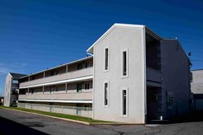 Orem apartment for rent - a large white building with a blue sky in the background