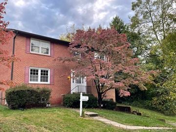 Kensington house for rent - a red brick house with a tree in front of it