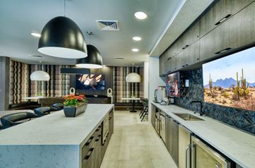 Phoenix apartment for rent - a kitchen and living room with a large screen tv