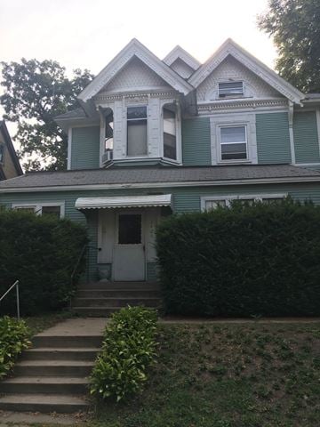 Minneapolis apartment for rent - A blue house with a white door and windows.