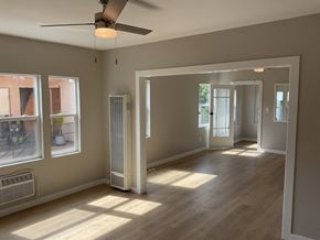 Los Angeles apartment for rent - an empty living room with wood floors and a ceiling fan