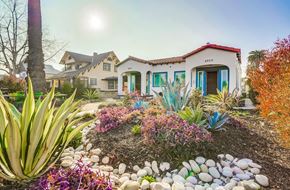 Los Angeles apartment for rent - A house with a red roof and a garden in front.