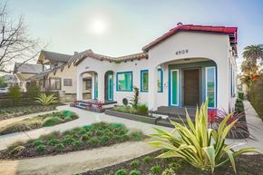 Los Angeles apartment for rent - A white house with a red roof and blue trim.