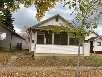 Prince Albert house for rent - a white house with a tree in front of it