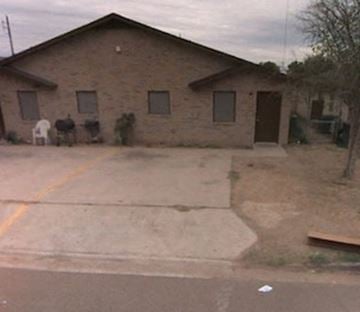 Laredo house for rent - a house with a driveway and a horse in front of it