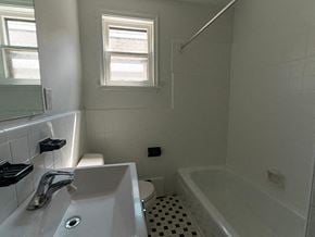 Toronto apartment for rent - a bathroom with a tub sink and a toilet