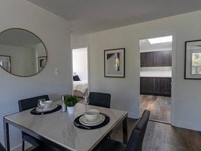 Toronto apartment for rent - a dining room with a table and chairs and a mirror