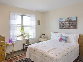 West Roxbury apartment for rent - a bedroom with a bed and a window