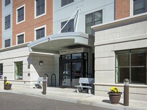 West Roxbury apartment for rent - the front entrance of a building with a wheelchair accessible ramp