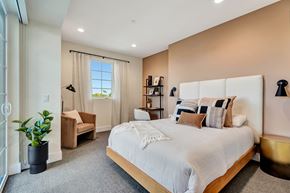 Los Angeles apartment for rent - A bedroom with a large bed and a window with curtains.