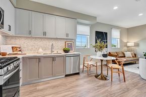 Los Angeles apartment for rent - A modern kitchen with a dining table and chairs.